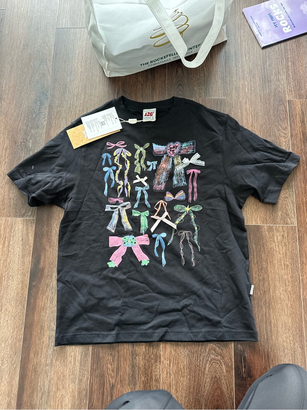 Black Graphic Tee with Colorful Bow Illustrations